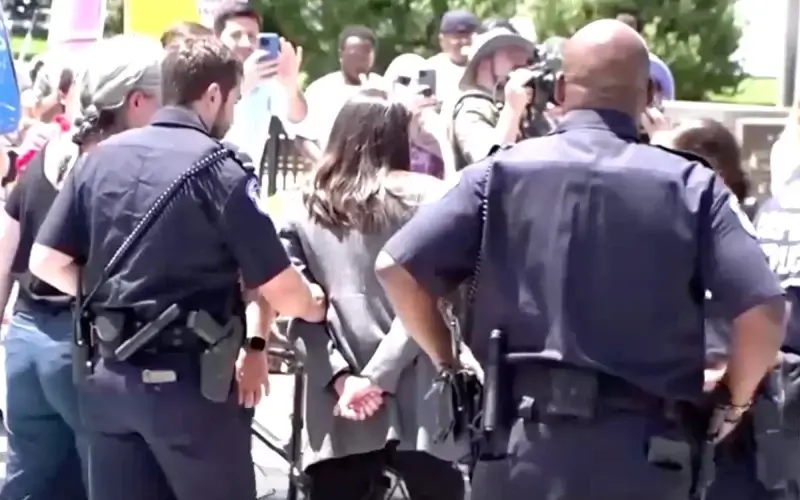 AOC was quickly mocked on social media for her faux handcuffs. Reuters