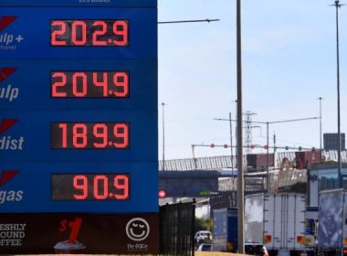 A sign outside a petrol station shows the price of petrol breaking through the two Australian dollar (1.46 USD) a litre mark in Melbourne, Victoria, on March 3, 2022. (William West/AFP via Getty Images)