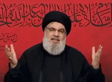 Lebanon's Hezbollah leader Sayyed Hassan Nasrallah speaks through a screen during a religious ceremony marking Ashura (photo credit: AL-MANAR/HANDOUT VIA REUTERS)
