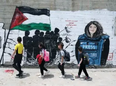 Palestinian children walk past a mural of Al Jazeera journalist Shireen Abu Akleh in Bethlehem. (photo credit: WISAM HASHLAMOUN/FLASH90)