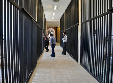 Guards looking into a prison cell in Iran. Photo by Babak Farrokhi on Flickr. (CC BY 2.0)