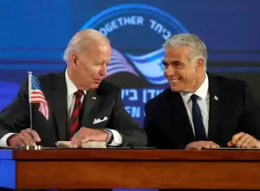 US President Joe Biden and Israeli Prime Minister Yair Lapid sign a security pledge at Waldorf Astoria Hotel in Jerusalem, Israel July 14, 2022 (photo credit: ATEF SAFADI/POOL VIA REUTERS)