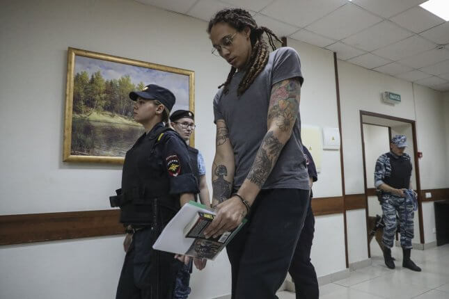 Two-time Olympic gold medalist and WNBA player Brittney Griner (C) is escorted to hear the court's verdict in Khimki City Court outside Moscow on Thursday. Photo by Maxim Shipenkov/EPA-EFE
