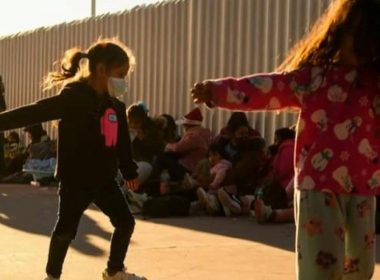 Migrant children playing at a border detention facility | CBS News report screenshot