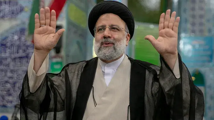 Ebrahim Raisi, a candidate in Iran's presidential elections, waves to the media after casting his vote at a polling station June 18, 2021, on the day of the Islamic republic's presidential election. (Majid Saeedi/Getty Images)