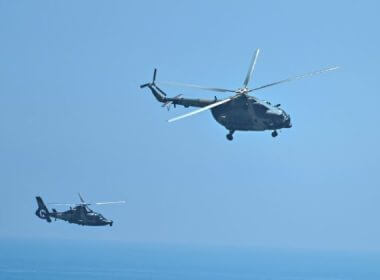 Chinese military helicopters fly past Pingtan Island, one of mainland China's closest points to Taiwan, in Fujian Province, ahead of military drills around Taiwan, on Aug. 4, 2022. (Hector Retamal/AFP via Getty Images)