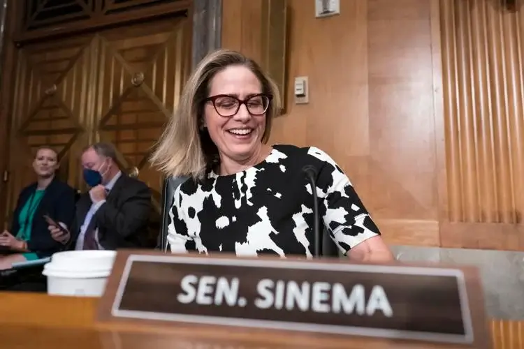 Sen. Kyrsten Sinema, D-Ariz., arrives for a meeting of the Senate Homeland Security Committee at the Capitol in Washington, Wednesday, Aug. 3, 2022. AP