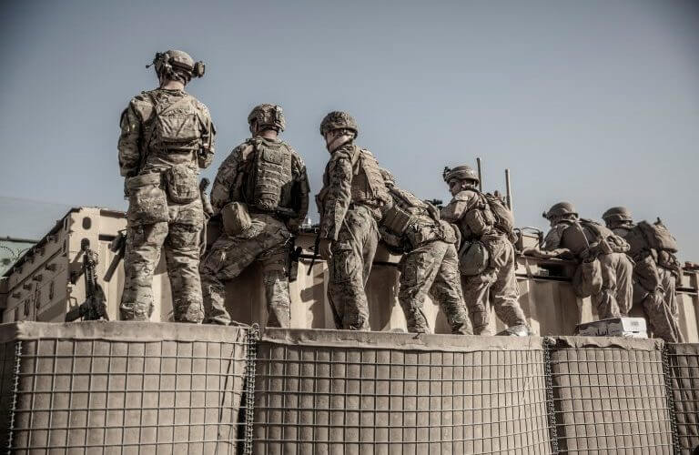 U.S. service members assist with security at an Evacuation Control Check Point (ECC) during an evacuation at Hamid Karzai International Airport, Kabul, Afghanistan, August 26, 2021. U.S. Marine Corps/Staff Sgt. Victor Mancilla/Handout via REUTERS.