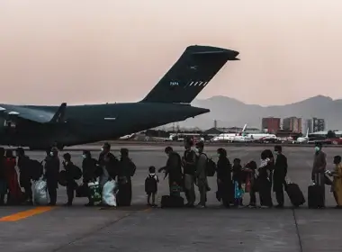 Evacuees wait to board a Boeing C-17 Globemaster III during an evacuation at Hamid Karzai International Airport in Kabul, Afghanistan, on Aug. 23, 2021. (U.S. Marine Corps photo by Sgt. Isaiah Campbell)