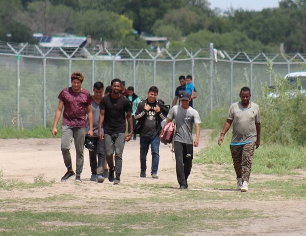 With no Border Patrol agents available, a group of migrants surrenders to Texas National Guard soldiers. (Randy Clark/Breitbart Texas)