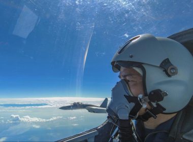 In this photo released by Xinhua News Agency, an air force pilot from the Eastern Theater Command of the Chinese People's Liberation Army (PLA) looks as they conduct a joint combat training exercises around the Taiwan Island on Sunday, Aug. 7, 2022.