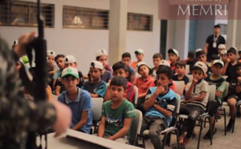 Young boys hear a lesson about weapons in a camp in Jebalia, July 25-28, 2022. Credit: MEMRI.