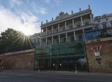 The sun sets behind the Palais Coburg where closed-door nuclear talks take place in Vienna, Austria, Aug. 5, 2022.