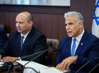 Prime Minister Yair Lapid (right) and alternate prime minister Naftali Bennett at a cabinet meeting at the Prime Minister's Office in Jerusalem on July 31, 2022. (Marc Israel Sellem/Pool)