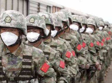 In this handout photo taken from video released by Russian Defense Ministry Press Service on Monday, Aug. 29, 2022, Chinese soldiers arrive to the Grodekovo railway station to participate in war games drills, in Grodekovo, Primorsky Krai, Russia. (Russian Defense Ministry Press Service via AP)