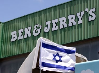 An Israeli flag is set atop a delivery truck outside ice-cream maker Ben & Jerry's factory in Be'er Tuvia, on July 21, 2021. (Emmanuel Dunand/Getty Images)