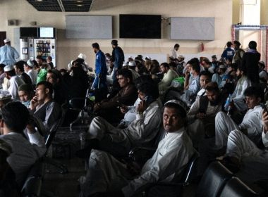 Passengers sit inside an airport terminal before boarding their flights in Kabul, Afghanistan on Aug. 1, 2021. (Wakil Kohsar/AFP via Getty Images)