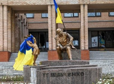 Ukrainian flags placed on statues in a square in Balakliya, Kharkiv region, amid the Russian invasion of Ukraine. Ukrainian forces said on September 10, 2022 they had entered the town of Kupiansk in eastern Ukraine, dislodging Russian troops from a key logistics hub. (Juan Barreto/AFP via Getty Images)