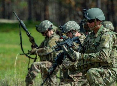 Members of the 182nd Infantry Regiment load their weapons with live ammunition before heading into the field to train at Fort Dix near Trenton, N.J., on May 16, 2022. (Joseph Prezioso /AFP via Getty Images)