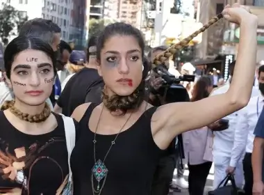 Two women vividly demonstrate their disdain for the current Iranian regime during a protest in Dag Hammerskjold Park across from the U.N. headquarters. (John Mantel for Fox News Digital)