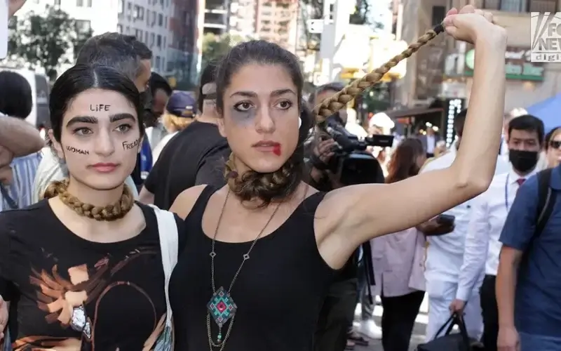Two women vividly demonstrate their disdain for the current Iranian regime during a protest in Dag Hammerskjold Park across from the U.N. headquarters. (John Mantel for Fox News Digital)