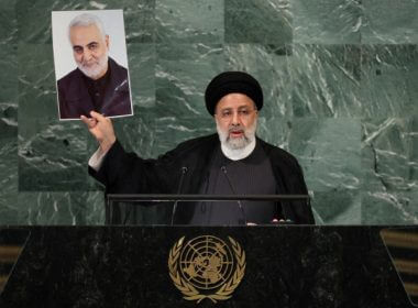 Iran's President Ebrahim Raisi holds up a picture of Quds Force Commander General Qassem Soleimani, who was killed in a U.S. attack, as he addresses the 77th Session of the United Nations General Assembly at U.N. Headquarters in New York, Sept. 21, 2022. (Photo: REUTERS/Brendan McDermid)