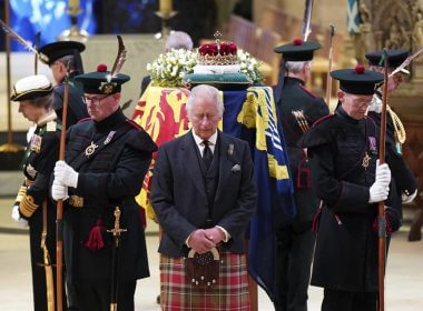 Britain's King Charles III, center, and other members of the royal family hold a vigil at the coffin of Queen Elizabeth II at St Giles' Cathedral, Edinburgh, Scotland, Monday Sept. 12, 2022. (Jane Barlow/Pool via AP)