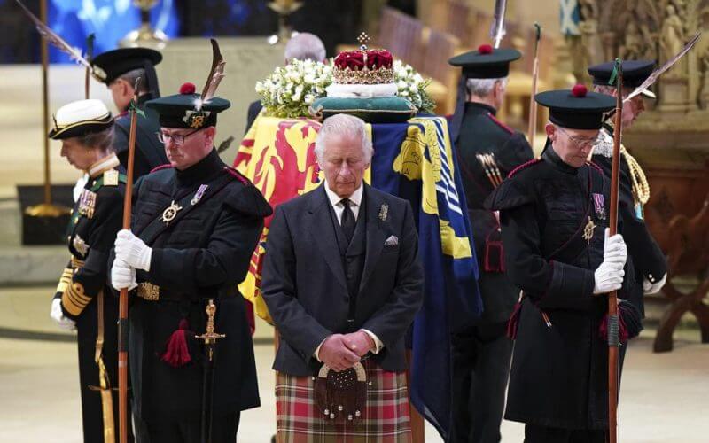 Britain's King Charles III, center, and other members of the royal family hold a vigil at the coffin of Queen Elizabeth II at St Giles' Cathedral, Edinburgh, Scotland, Monday Sept. 12, 2022. (Jane Barlow/Pool via AP)