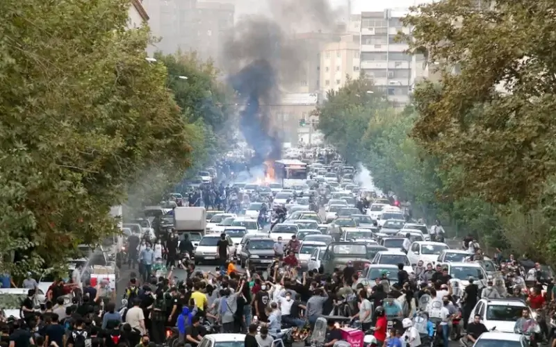 In this photo taken by an individual not employed by the Associated Press and obtained by the AP outside Iran, protesters chant slogans during a protest over the death of a woman who was detained by the morality police, in downtown Tehran, Iran, Sept. 21, 2022. (AP Photo, File)