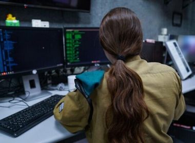 An Israeli soldier of the C4I Corps works at a computer, in an undated photo published by the military on September 21, 2022. (Israel Defense Forces)