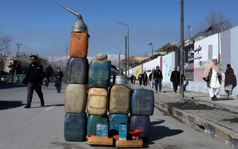 Cans containing gasoline are kept for sale on a road in Kabul, Afghanistan, January 27, 2022. REUTERS/Ali Khara