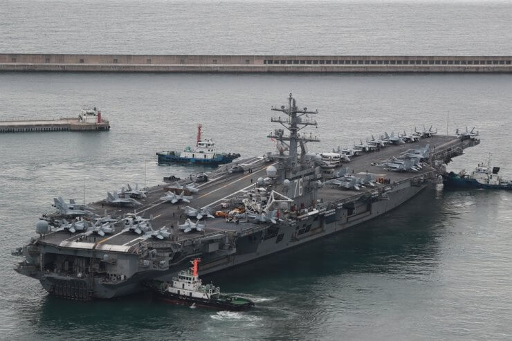 USS Ronald Reagan, a U.S. Navy Nimitz-class nuclear-powered aircraft carrier, departs from the South Korean Fleet Command in Busan, Monday, for combined drills with the South Korean Navy. The two allies have begun their biggest naval exercise in five years in response to North Korea's intensifying nuclear threat. Yonhap