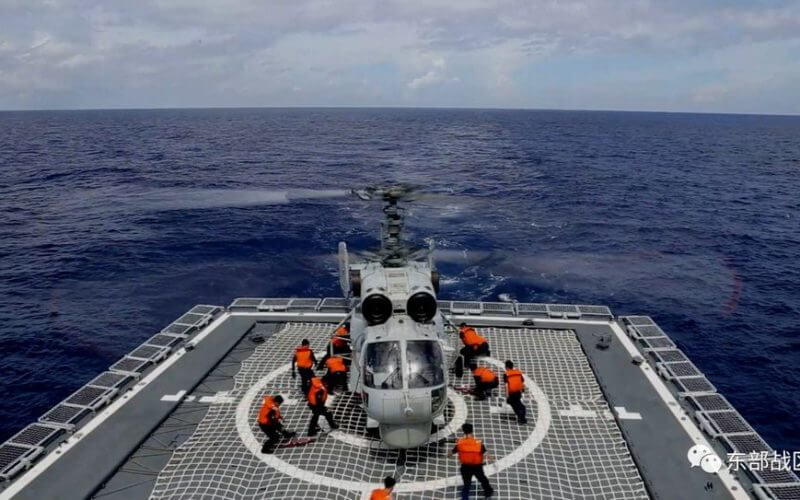 A Navy Force helicopter under the Eastern Theatre Command of China's People's Liberation Army (PLA) takes part in military exercises in the waters around Taiwan, at an undisclosed location August 8, 2022 in this handout picture released on August 9, 2022. Eastern Theatre Command/Handout via REUTERS
