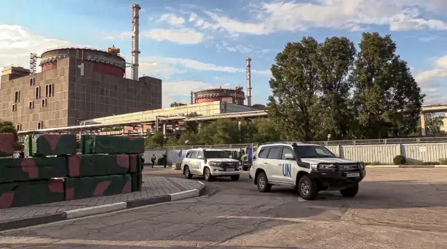 In this handout photo taken from video released by Russian Defense Ministry Press Service on Friday Sept. 2, 2022, a motorcade with members of International Atomic Energy Agency (IAEA) leaves after inspecting the Zaporizhzhia Nuclear Power Plant in Enerhodar, southeastern Ukraine Thursday Sept. 1, 2022. AP