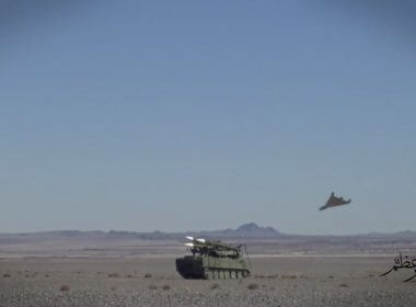 A triangle-shaped suicide drone approaches the target during a drill in Iran. | Imamedia via AP