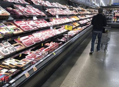 In this May 10, 2020, file photo, a shopper pushes his cart past a display of packaged meat in a grocery store in southeast Denver. David Zalubowski / AP