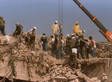 Rescue workers sift through the rubble of the U.S. Marine base in Beirut in Oct. 23, 1983 following a massive bomb blast that destroyed the base and killed 241 American servicemen. AP