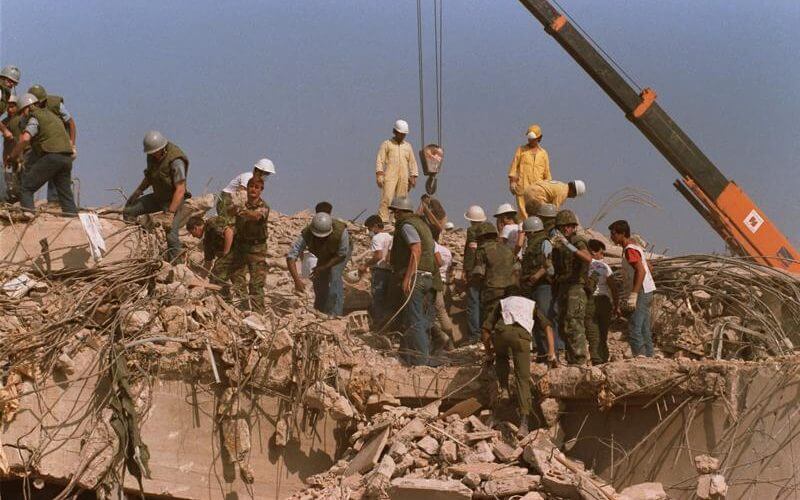 Rescue workers sift through the rubble of the U.S. Marine base in Beirut in Oct. 23, 1983 following a massive bomb blast that destroyed the base and killed 241 American servicemen. AP