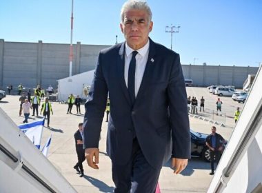 Prime Minister Yair Lapid boards a plane at Ben Gurion Airport taking him to Berlin, Germany, on September 11, 2022. (Kobi Gideon/GPO)