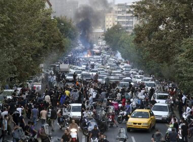 In this Wednesday, Sept. 21, 2022, photo taken by an individual not employed by the Associated Press and obtained by the AP outside Iran, protesters chant slogans during a protest over the death of a woman who was detained by the morality police, in downtown Tehran, Iran. AP