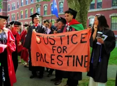 Harvard University students displaying a pro-Palestinian sign at their May 2022 graduation ceremony. Photo: Reuters/Brian Snyder