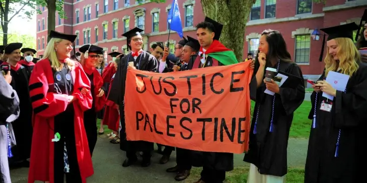 Harvard University students displaying a pro-Palestinian sign at their May 2022 graduation ceremony. Photo: Reuters/Brian Snyder