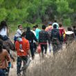 Illegal immigrants, most from Honduras, walk toward a U.S. Border Patrol checkpoint after crossing the Rio Grande from Mexico near Mission, Texas, on March 23, 2021. (John Moore/Getty Images)