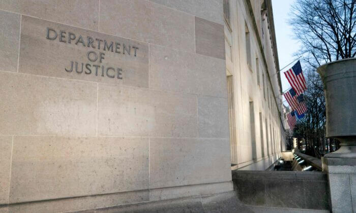 The Department of Justice building in Washington on Feb. 9, 2022. (STEFANI REYNOLDS/AFP via Getty Images)