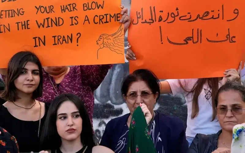 Kurdish women activists hold up placards during a protest against the death of Iranian Mahsa Amini in Iran, at Martyrs' Square in downtown Beirut, Lebanon, Wednesday, Sept. 21, 2022. (AP Photo/Bilal Hussein)