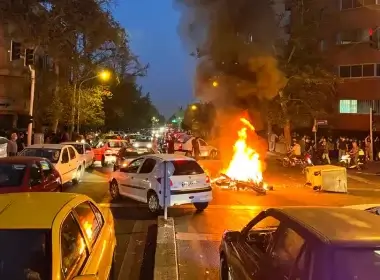 In this Sept. 19, 2022, photo taken by an individual not employed by the Associated Press and obtained by the AP outside Iran, a police motorcycle burns during a protest over the death of a young woman who had been detained for violating the country's conservative dress code, in downtown Tehran, Iran. (AP Photo, File)