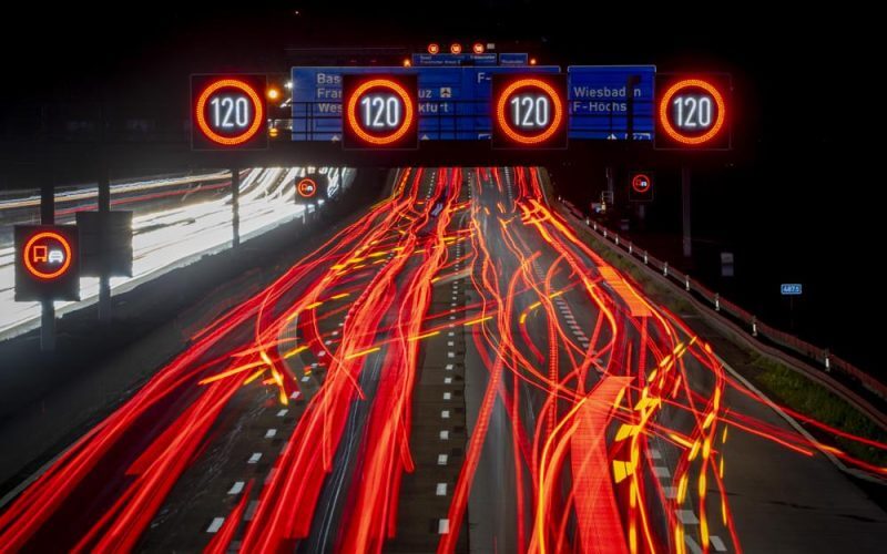 A long exposure photo shows traffic moving along a highway in Frankfurt, Germany, early Thursday, Oct. 6, 2022. (AP Photo/Michael Probst)