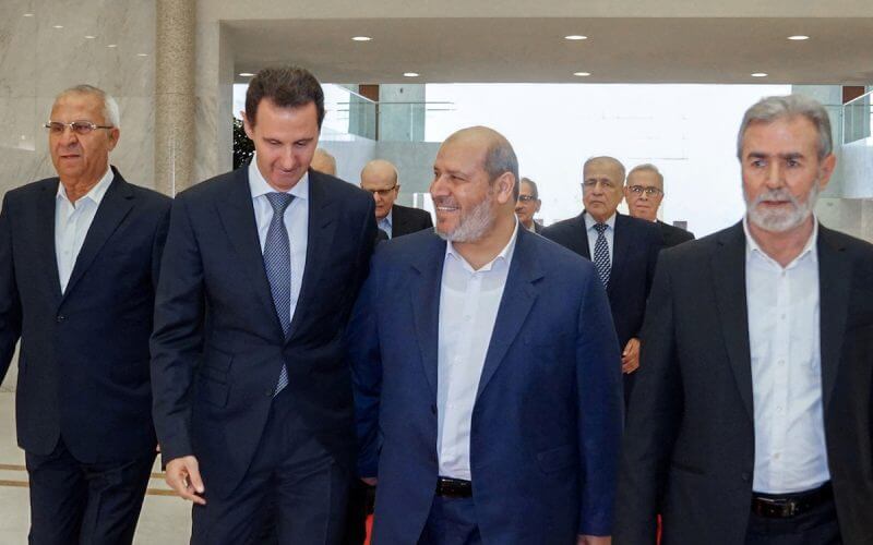 Syria's President Bashar al-Assad meets with Hamas politburo member Khalil al-Hayya in Damascus, Syria, Oct. 19, 2022. (Photo: SANA/Handout via REUTERS)