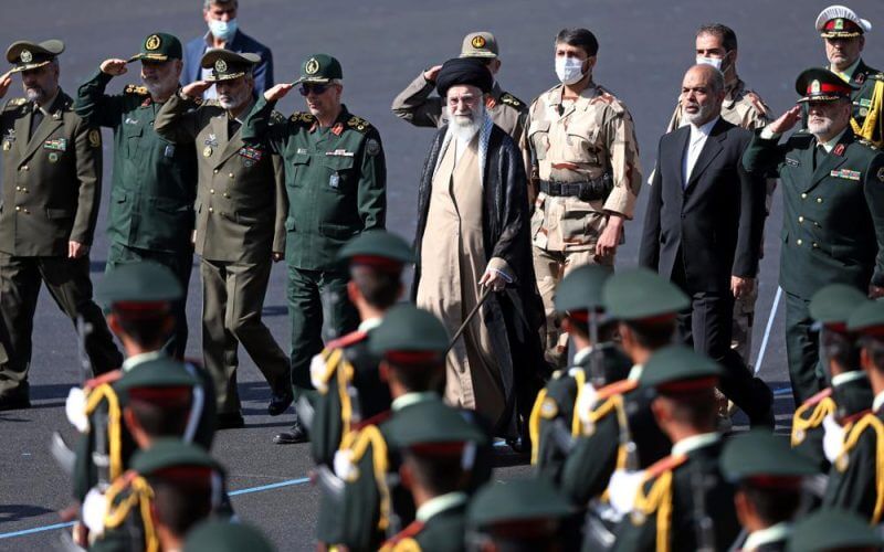 In this picture released by the official website of the office of the Iranian supreme leader, Supreme Leader Ayatollah Ali Khamenei, center, reviews a group of armed forces cadets during their graduation ceremony accompanied by commanders of the armed forces, at the police academy in Tehran, Iran, Monday, Oct. 3, 2022. AP