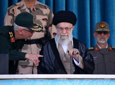 In this picture released by the official website of the office of the Iranian supreme leader, Supreme Leader Ayatollah Ali Khamenei, center, listens to chief of the General Staff of the Armed Forces Gen. Mohammad Hossein Bagheri at a graduation ceremony for a group of armed forces cadets at the police academy in Tehran, Iran, Monday, Oct. 3, 2022. AP